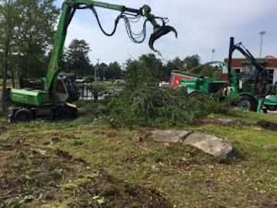 Mayer Tree Service’s Sennebogen 718 teams up with his Albach 2000. One cuts, stacks and organizes while the other chips. Photo: Sennebogen