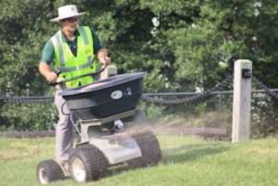 Volunteers apply lime to multiple areas of the cemetery. Photo: Beth Hyatt