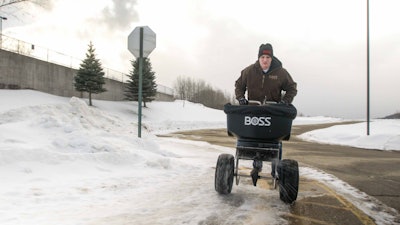 The Boss walk-behind spreader spreads up to 80 or 100 pounds of bag salt. Photo: Boss Snowplow