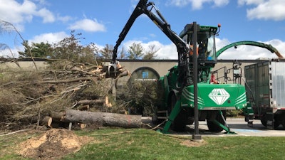 The Diamant 2000 loads on one side while the chute on the other side loads the trailer. Photo: Albach
