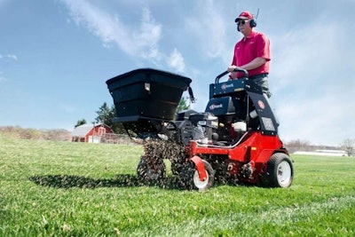 Exmark shows off spreader attachment for stand on aerator Total