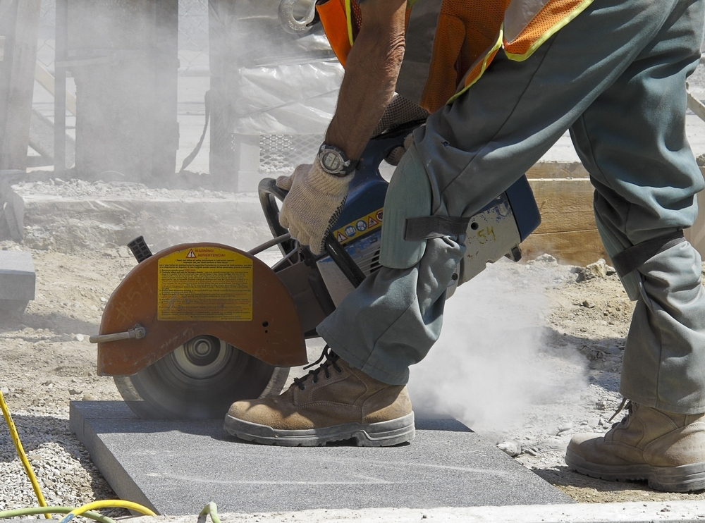 worker-sawing-slab
