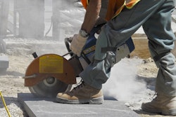 worker-sawing-slab