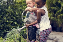 little-girls-watering-can