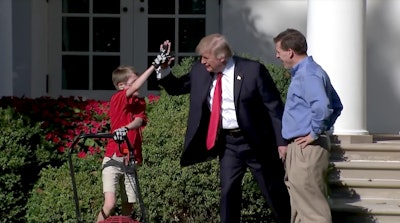 President Trump gives Frank Giaccio a high five for a job well done.