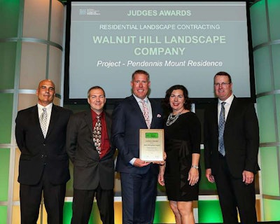 Walnut Hill Landscape Company accepts its Judges Award in Louisville. Photo: NALP/Philippe Nobile