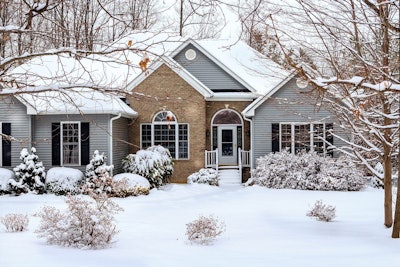 snow covered house and yard