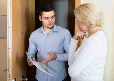 landscaper and customer discuss payment