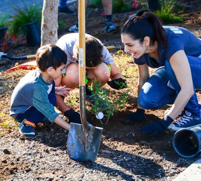 Volunteers from Hunter Industries pitch into help with new plantings at William Bradley Park. Photo: Project EverGreen