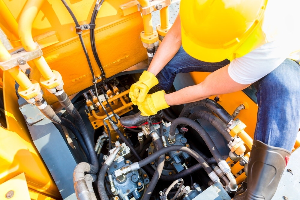 man-working-on-equipment