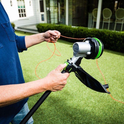 The Ego Powerload feature takes the hassle out of loading string trimmers. Photo: Home Depot