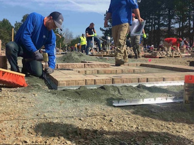 Teams hustled to complete their hardscape installations on Friday, March 16. Photo: Jill Odom
