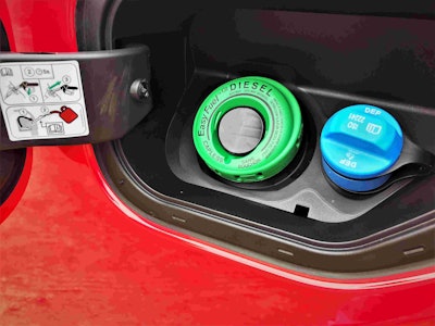 Up close photo of Ford's F-150 Diesel Truck Gas tank lime green cap-less fuel tank