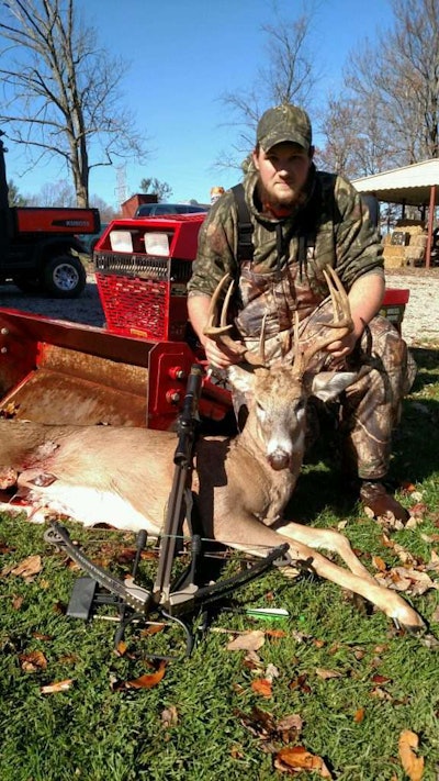 Chris G. sitting down by a deer on his Steiner 430
