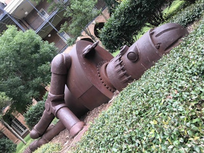 Unique art pieces, such as this 23-foot-long robot sculpture, are on display in Woods Quad. Photo: Beth Hyatt