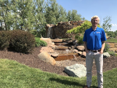Paul Fraynd poses outside the company’s supply yard entrance. Photo: Jill Odom/Total Landscape Care