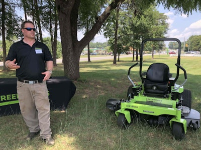 Corey Fisher, engineering manager of mowers and vehicles, gives a run down of the 60″ zero-turn mower. Photo: Jill Odom
