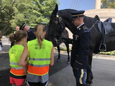 Kids had the opportunity to feed peppermints to the caisson horses. Photo: Jill Odom