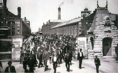 Workers leave the Pullman Palace Car Works. Photo: Wikipedia