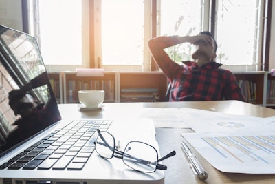 Landscaper contemplating mistake from a job