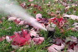 sprinkler-by-red-leaves