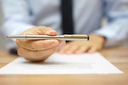 guy-handing-off-pen