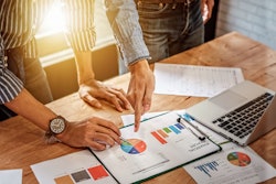 employees-looking-at-charts