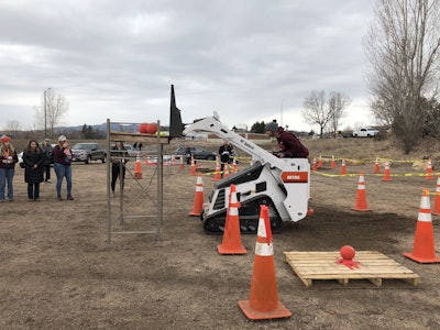 Participants in the mini track loader operation event strived to keep all the balls on the pallet as they dropped them at different check points. Photo: Jill Odom
