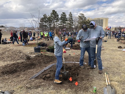 The University of Mount Olive team looked over the plans during the landscape plant installation event. Photo: Jill Odom