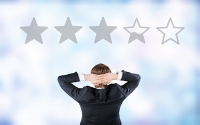 Three and a half stars above a businessman