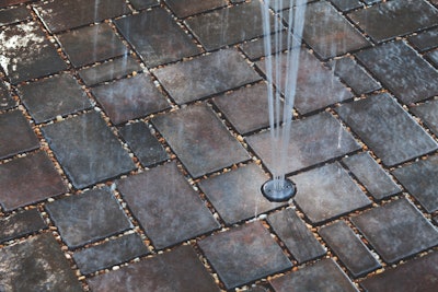 Permeable pavers help reduce standing water. Photo: Belgard