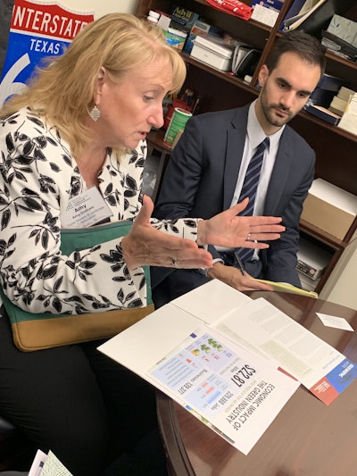 Amy Graham, president and CEO of the Texas Nursery and Landscape Association (TNLA), talks with assistants to Congressman Randy Weber. Photo: Beth Hyatt/Total Landscape Care