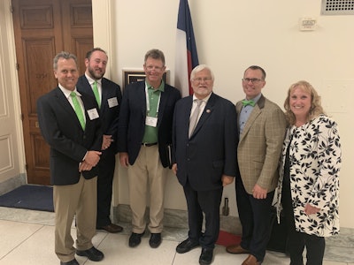 Pictured are, from left to right, Jay Williams, Ryan Skrobarczyk, Tim Portland, Rep. Kenny Marchant, Tim Little and Amy Graham. Photo: Beth Hyatt/Total Landscape Care