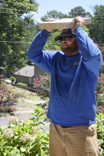 Crew members work to finish hardscaping projects. Photo: Beth Hyatt/Total Landscape Care