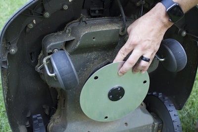 For customers concerned about the mower’s blades running over the feet of a pet or child, Chapman shows that the blades are safely tucked away far back into the undercarriage of the machine. Photo: Beth Hyatt/Total Landscape Care