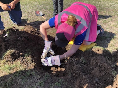 Volunteers replaced sprinkler heads as part of the Project EverGreen event. Photo: Jill Odom/Total Landscape Care