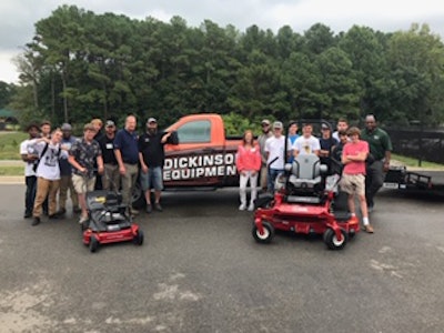Logan Horne of the Louisa County (Virginia) School District and students from district’s turf management program take delivery of an Exmark mower package from Project EverGreen Executive Director Cindy Code and representatives from the Sports Turf Managers Association and Dickinson Equipment, an Exmark distributor. Photo: Project EverGreen