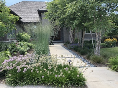 Jim Drzewiecki often uses his architectural background to create landscape designs that compliment the house. Photo: Jill Odom/Total Landscape Care