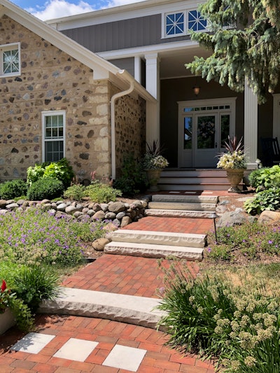 The square windows on the house are mirrored by the square pavers in the hardscaping. Photo: Jill Odom/Total Landscape Care