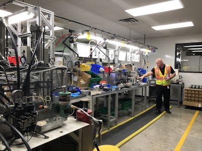 Ryan Ladley, vice president of operations, explains poka-yoke mechanisms in the assembly process. Photo: Jill Odom/Total Landscape Care