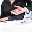 person-being-criticized-at-desk