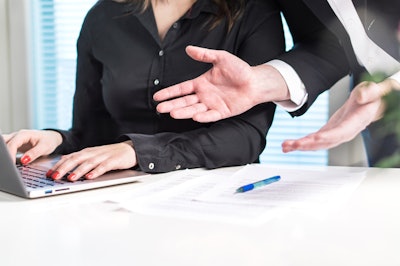 person-being-criticized-at-desk