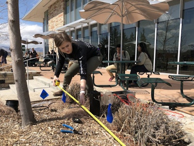 A student takes measurements during the landscape lighting event. Photo: Jill Odom/Total Landscape Care