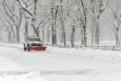 Truck Plowing In Snow