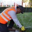 landscaper-adjusting-irrigation-sprinklers.jpg