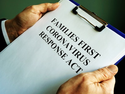 man holding blue clipboard with families first coronavirus response act