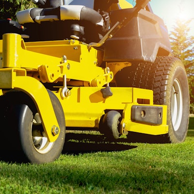 yellow lawn mower in yard