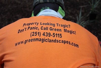 Landscaper wearing Green Magic Landscapes t-shirt