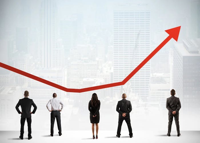 Business people standing in a row analyzing a red arrow