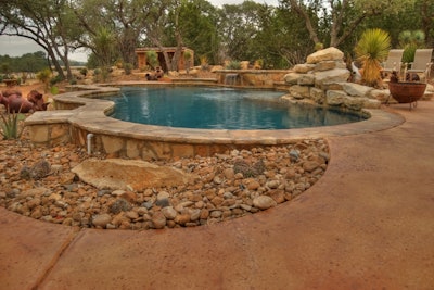 Desert garden surrounding a pool